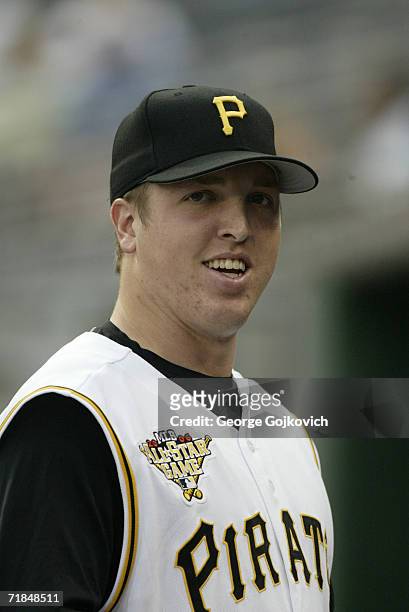 Pitcher Tom Gorzelanny of the Pittsburgh Pirates smiles while standing in the dugout before a game against the Houston Astros at PNC Park on August...