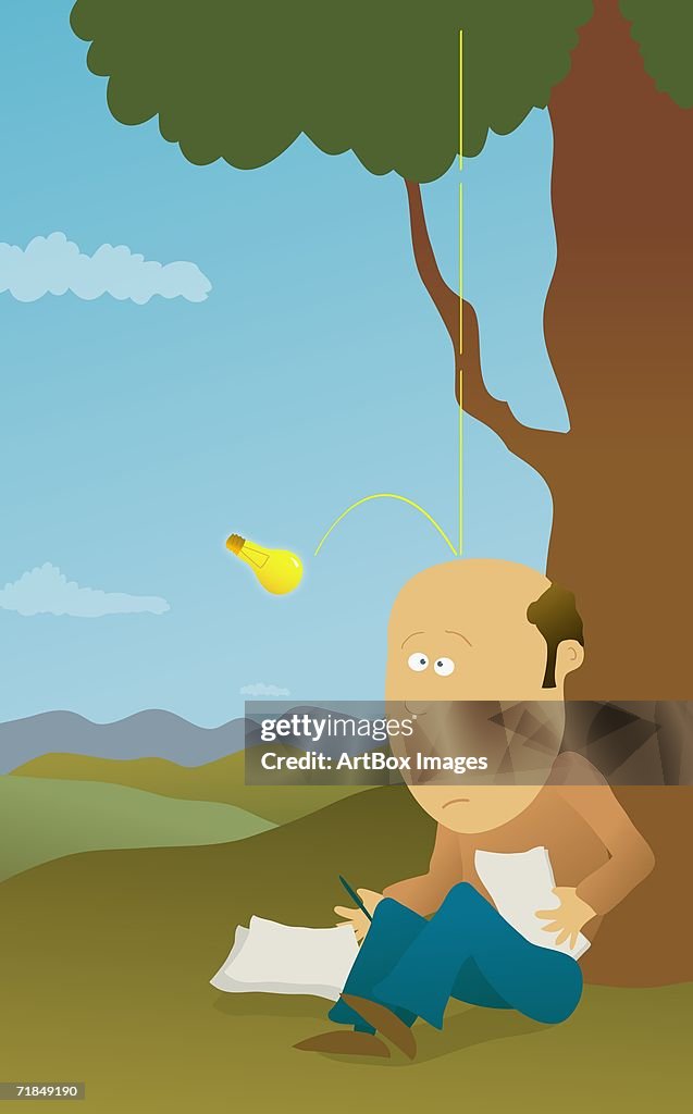 Light bulb falling from a tree and bouncing off a mid adult man's head