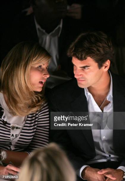 Tennis player Roger Federer and his girlfriend Mirka Vavrinec sit in the front row at the Oscar de la Renta Spring 2007 fashion show during Olympus...