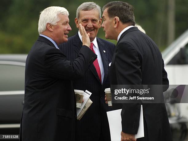 Pennsylvania Attorney General Tom Corbett, General Tommy Franks and former Homeland Security Director Tom Ridge talk before speaking at a memorial...