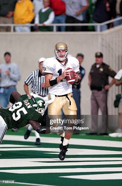 Gary Godsey of the Notre Dame Fighting Irish makes it into the end-zone against Josh Shaw of the Michigan State Spartans during the game at the...