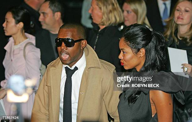 New York, UNITED STATES: Singer Kanye West and his fiance Alexis arrive for the Marc Jacobs Spring 2007 show at Olympus Fashion Week at the Armory,...