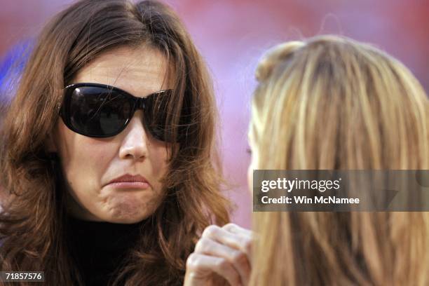 Katie Holmes stands on the field before a game between the Minnesota Vikings and the Washington Redskins during the first Monday Night Football game...