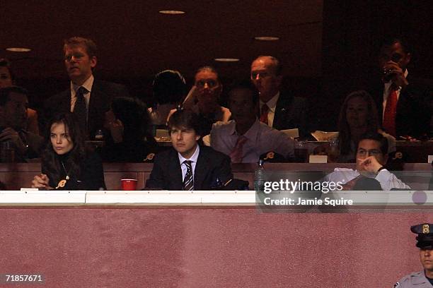 Tom Cruise , Katie Holmes and Daniel Snyder watch a game between the Minnesota Vikings and the Washington Redskins during the first Monday Night...