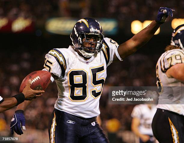 Antonio Gates of the San Diego Chargers celebrates after scoring a touchdown during the NFL game against the Oakland Raiders at McAfee Coliseum on...