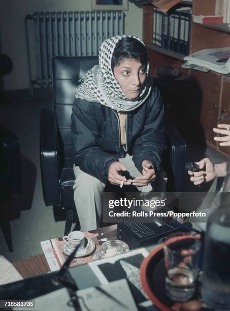 Palestinian hijacker and member of the Popular Front for the Liberation of Palestine, Leila Khaled pictured wearing a Keffiyeh as she is interviewed...