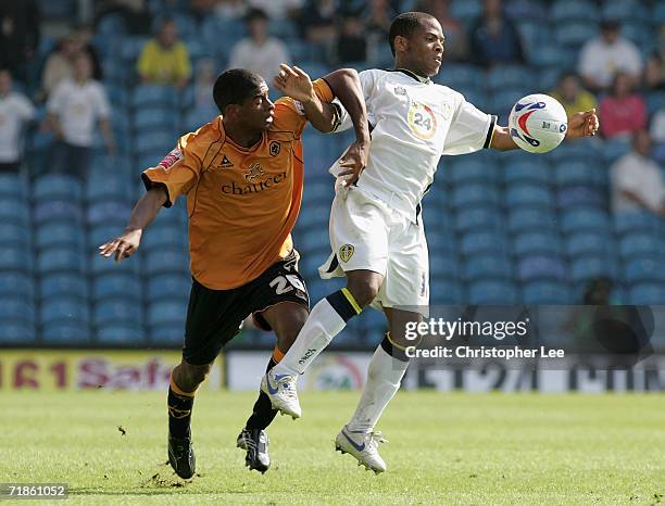 Seb Carole of Leeds battles with Mark Little of Wolverhampton Wanderers during the Coca-Cola Championship match between Leeds United and...