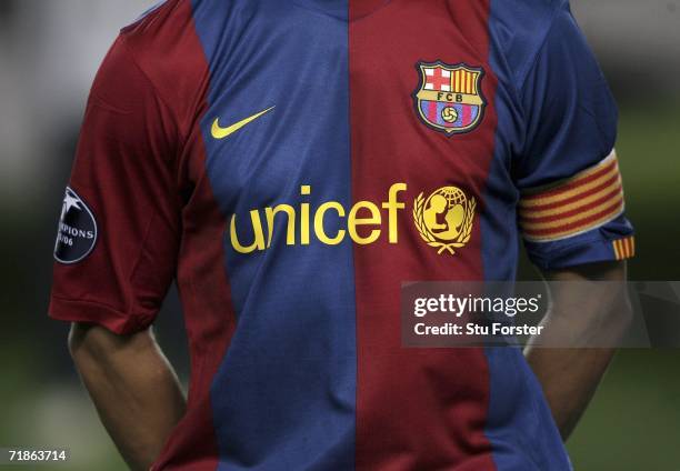 The Barcelona captain Carles Puyol in the team line up before the game with their new 'UNICEF' shirt during the UEFA Champions League Group A match...