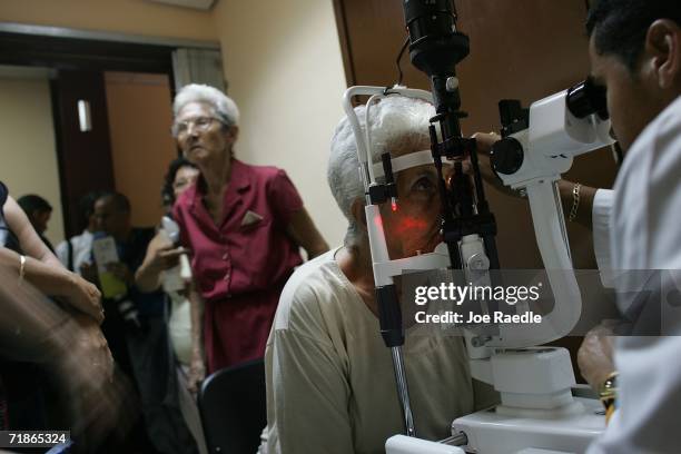 Josefa Martinena Perez has her eyes checked by Dr. Omar Diaz Arncibia as she takes advantage of "Operacion Milagro" September 12, 2006 at Pando...