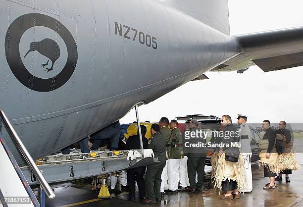 The body of the late Tongan King Taufa'ahau Tupou IV is carried from the hearse to the Hercules plane at Whenuapai Airbase, September 13, 2006 in...