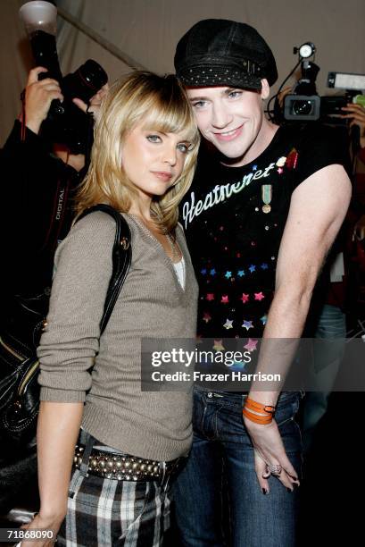 Actress Mena Suvari and designer Richie Rich pose backstage at the Heatherette Spring 2007 fashion show during Olympus Fashion Week at the Tent in...