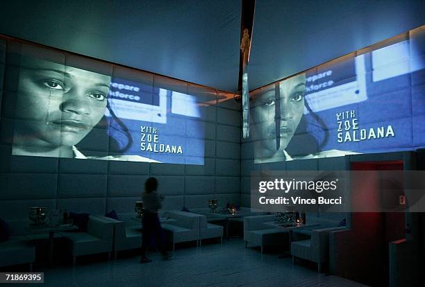 Screen projection of actress Zoe Saldana is shown on the wall at the after party for Yari Film Group's "Haven" at the Privilege Night Club on...