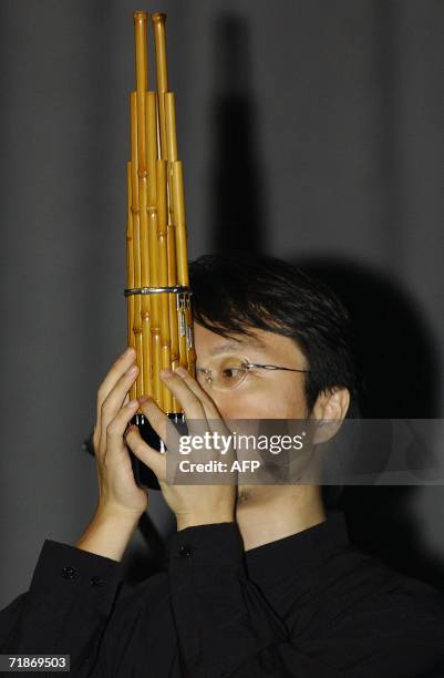 The Japanese musician Naoyuki Manabe plays a traditional Japanese musical instrument "Sho" during "Sounds of Traditional Japan - Today" concert at...