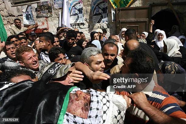 Palestinian carry the body of Palestinian militant, Ihab Abu Salha a member of the Al-Aqsa Martyrs Brigade, the loosely affiliated armed wing of...