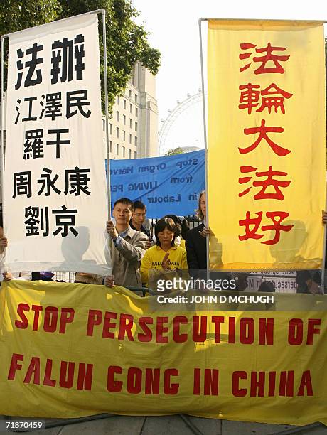 United Kingdom: Falun Gong protestors gather outside 10 Downing Street in London, 13 September 2006, where British Prime Minister Tony Blair is...