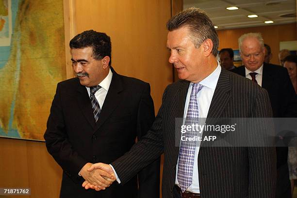 Israeli Defence Minister Amir Peretz shakes hands with Belgian Foreign Minister Karel De Gucht in Tel Aviv 24 August 2006. De Gucht was also...