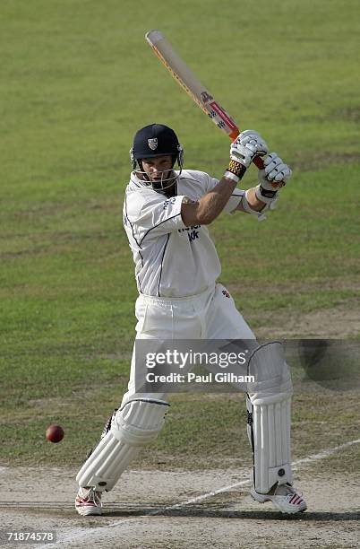 Dale Benkenstein of Durham hits out during day one of four of the Liverpool Victoria County Championship match between Lancashire and Durham at Old...