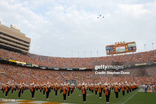 The band of the University of Tennessee Volunteers take the field and the bomber flys overhead before the game against the Air Force Academy Falcons...