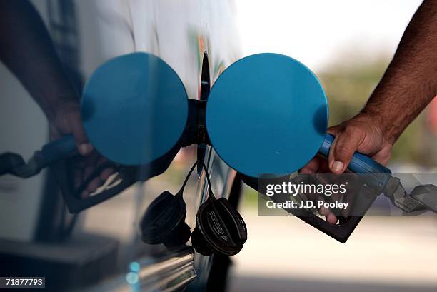 Man fills the tank of his pick-up truck on September 13 in Toledo, Ohio. Toledo has seen some of the lowest recorded gas prices in the country.