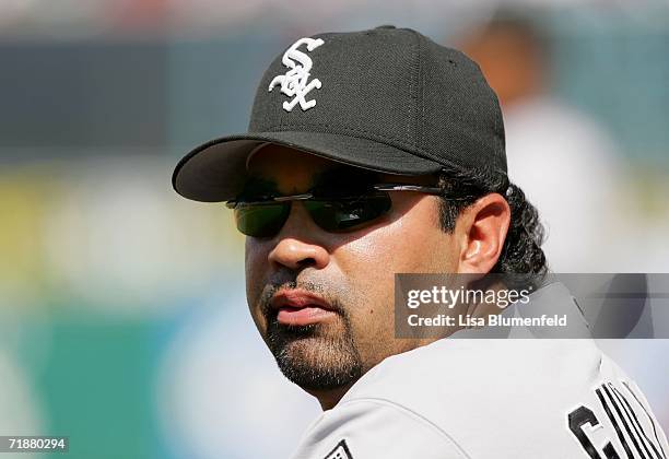 Manager Ozzie Guillen of the Chicago White Sox looks on from the dugout during the game against the Los Angeles Angels of Anaheim on September 13,...