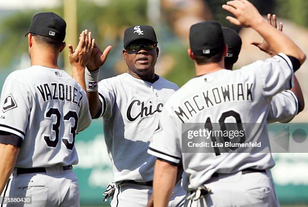 Juan Uribe of the Chicago White Sox celebrates with his teammates after defeating the Los Angeles Angels of Anaheim on September 13, 2006 at Angel...