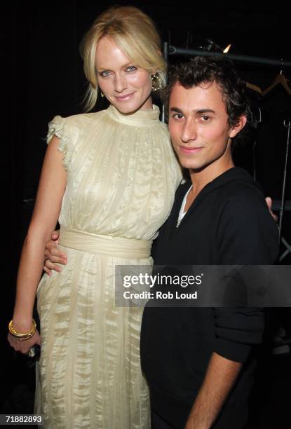 Actress Amber Valletta and designer Esteban Cortazar pose backstage at the Esteban Cortazar Spring 2007 Fashion show during Olympus Fashion Week at...