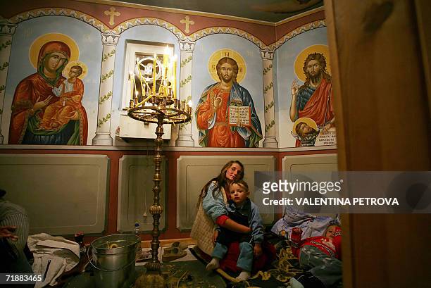 Bulgarian family prepares to spend the night at a chapel in Krastova Gora late 13 September 2006. Thousands of Bulgarian pilgrims are to attend an...