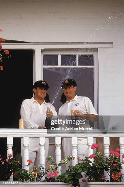 Australian cricketers Mark Taylor and Geoff Marsh celebrate their stand of 329 for the first wicket during the 5th Test in the Ashes series at Trent...