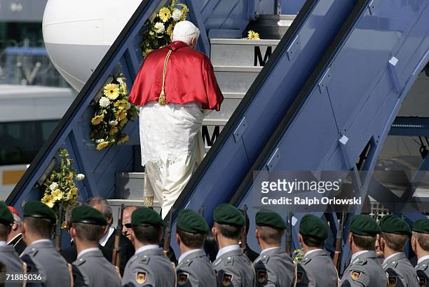 Pope Benedict XVI climbs the gangway to his plane at Munich Airport on September 14, 2006 in Munich, Germany. The Pope leaves his native Bavaria on...