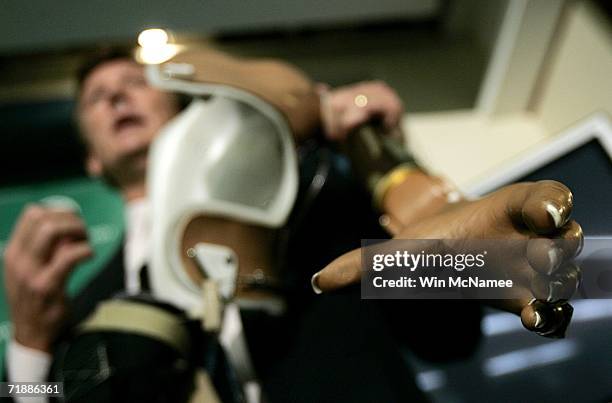 Dr. Todd Kuiken demonstrates the functionality of a "bionic arm" during a news conference on September 14, 2006 in Washington, DC. Kuiken is the...