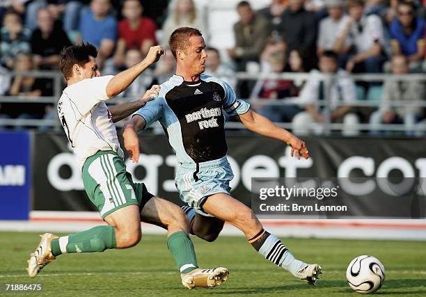 Tihhon Sisov of FC Levadia tackles Scott Parker of Newcastle United during the UEFA Cup first round, first leg match bewteen FC Levadia and Newcastle...