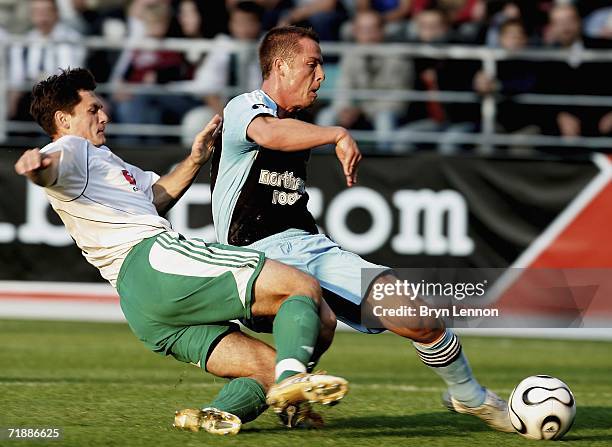 Tihhon Sisov of FC Levadia tackles Scott Parker of Newcastle United during the UEFA Cup first round, first leg match between FC Levadia and Newcastle...