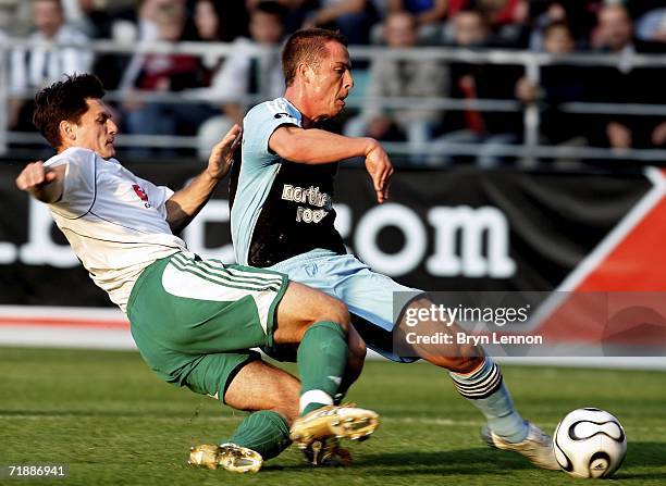 Tihhon Sisov of FC Levadia tackles Scott Parker of Newcastle United during the UEFA Cup first round, first leg match bewteen FC Levadia and Newcastle...