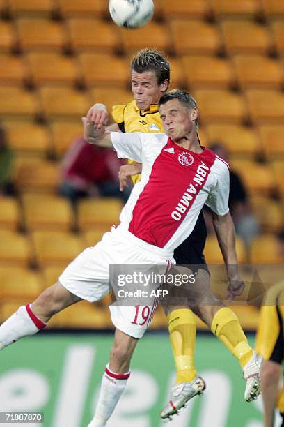 Start's player Marius Johnsen tackles Ajax Markus Rosenberg in the first round of the UEFA Cup match at Arasen Stadium in Lillestrom, 14 September...