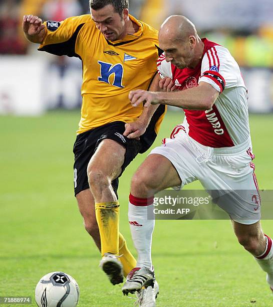 Start player Todi Jonsson tackles Ajax Jaap Stam in the first round of the UEFA football Cup at Arasen Stadium in Lillestrom 14 September 2006. Ajax...