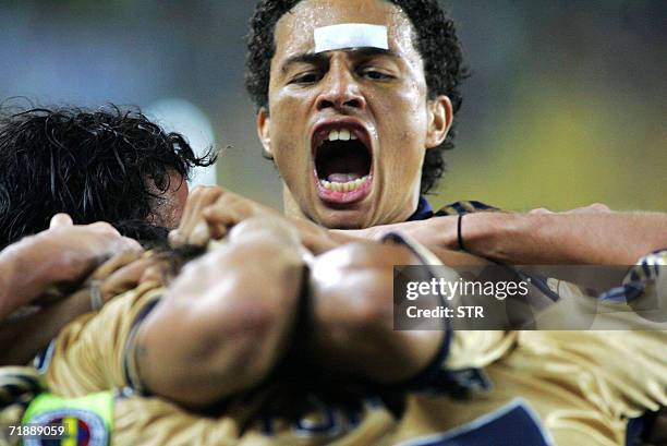 Fenerbahce`s Alex de Souza celebrates his goal with his teammates against Randers during their UEFA Cup first round soccer match at Sukru Saracoglu...