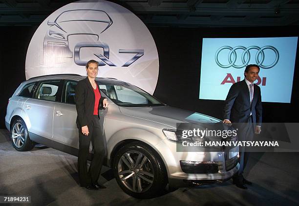 Executive Director, Overseas Region, German carmaker Audi, Andre Konsbruck and Product Manager, Audi Q7, Sandra Berger pose with the newly-launched...