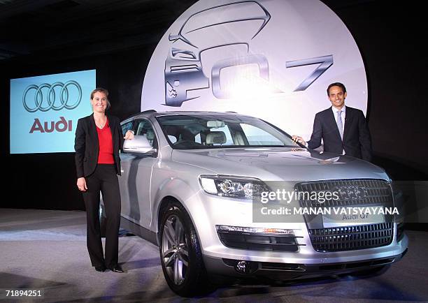 Executive Director, Overseas Region, German carmaker Audi, Andre Konsbruck and Product Manager, Audi Q7, Sandra Berger pose with the newly-launched...