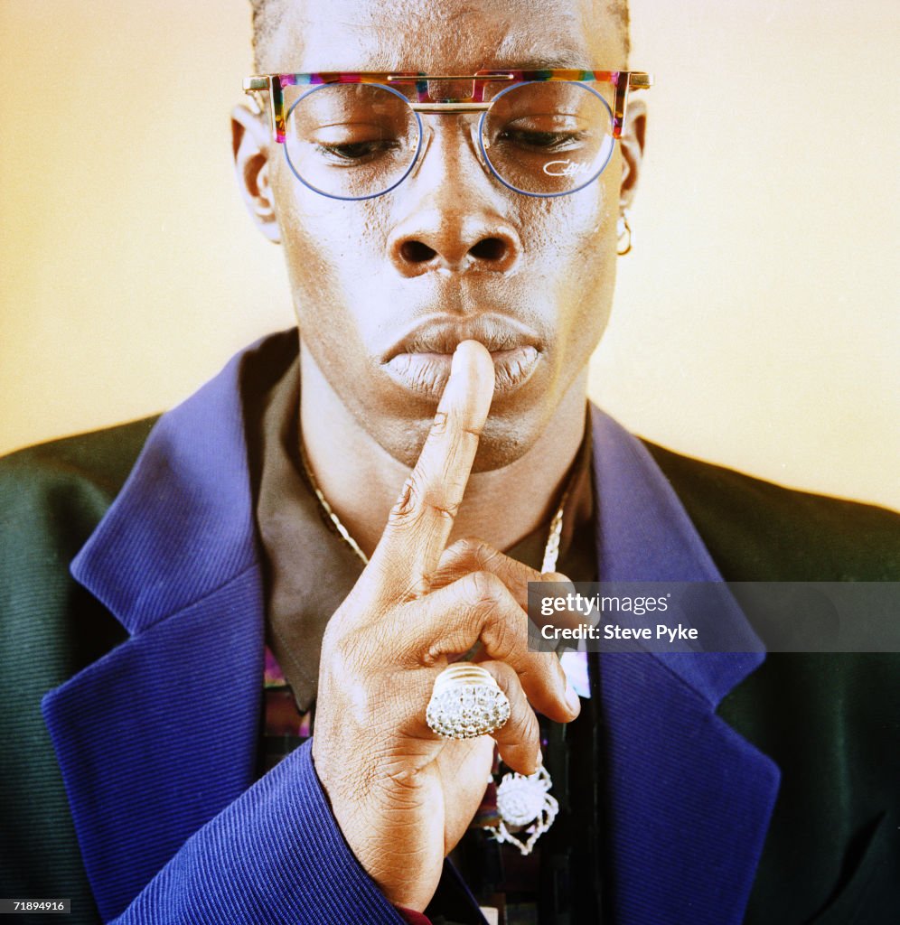 Shabba Racks Jamaican rapper, toaster and DJ Shabba Ranks, wearing a suit and ...