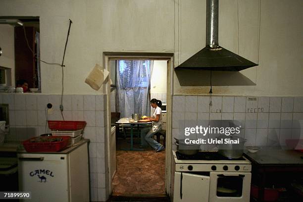 Waitress Julia Dohtokhonova works in the kitchen in IDOS restaurant, serving locals and workers from nearby factories despite a shortage of fresh...