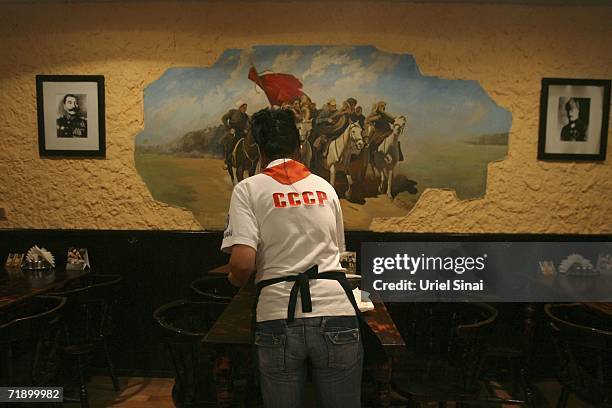 Waitress prepares tables in the CCCP restaurant, which was opened three years ago and decorated with Soviet and Communist symbols, August 9, 2006 in...