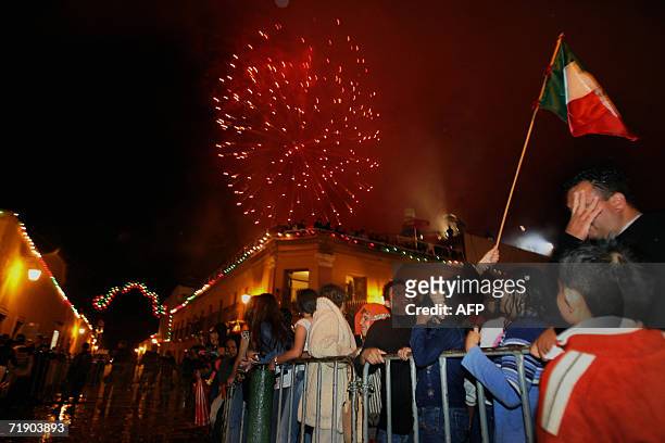 People watch fireworks display in Dolores Hidalgo Community in Guanajuato State during Mexico's Independence Day celebrations, 15 September 2006. AFP...