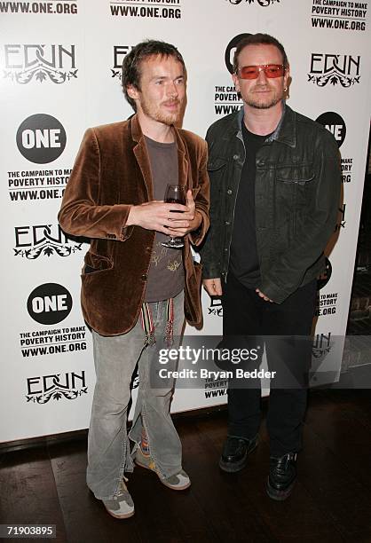 Musician Damien Rice and Bono attend the "Edun And One: The Campaign To Make Poverty History Launch" party at the Hudson Hotel during Olympus Fashion...