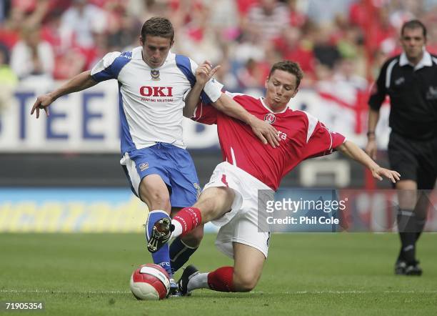 Matt Holland of Charlton Athletic tackles Sean Davis of Portsmouth during the Barclay's Premiership match between Charlton Athletic and Portsmouth at...