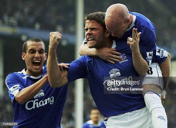 James Beattie of Everton celebrates with team mates Andy Johnson and Leon Osman after scoring from a penalty during the Barclays Premiership match...