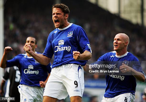 James Beattie of Everton celebrates with team mates Andy Johnson and Leon Osman after scoring from a penalty during the Barclays Premiership match...