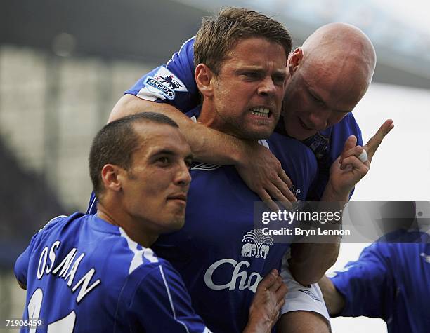 James Beattie of Everton celebrates with team mates Andy Johnson and Leon Osman after scoring from a penalty during the Barclays Premiership match...