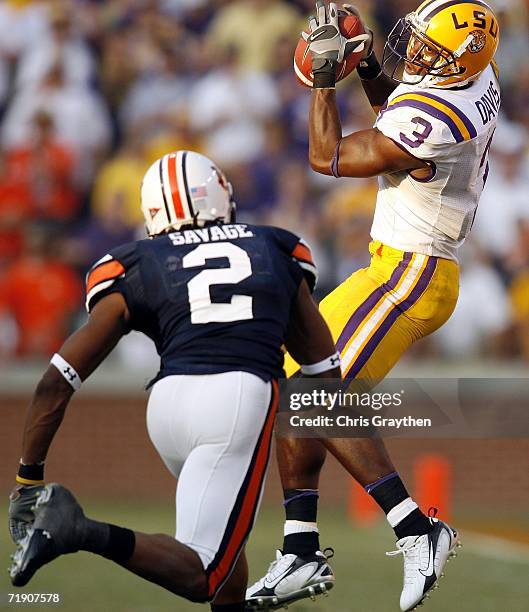 Craig Davis of the Louisiana State University Tigers makes a catch over Aairon Savage of the Auburn University Tigers September 16, 2006 at...