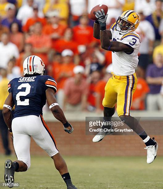 Craig Davis of the Louisiana State University Tigers makes a catch over Aairon Savage of the Auburn University Tigers September 16, 2006 at...