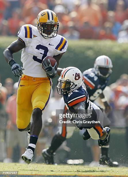 Craig Davis of the Louisiana State University Tigers avoids a tackle by Jonathan Wilhite of the Auburn University Tigers September 16, 2006 at...